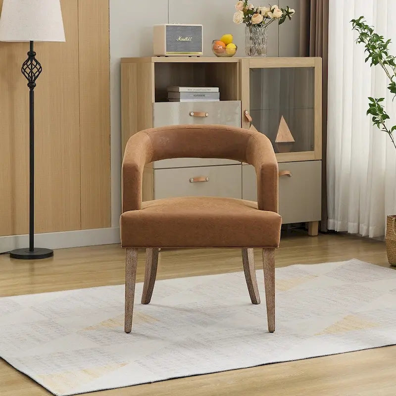 Sillón decorativo tapizado tipo barril con respaldo abierto
