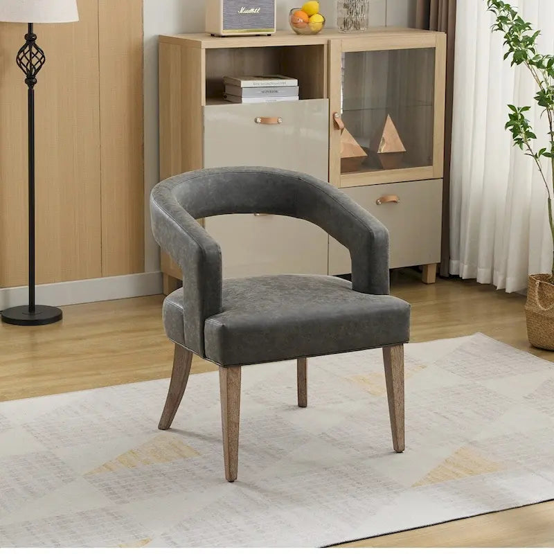 Sillón decorativo tapizado tipo barril con respaldo abierto
