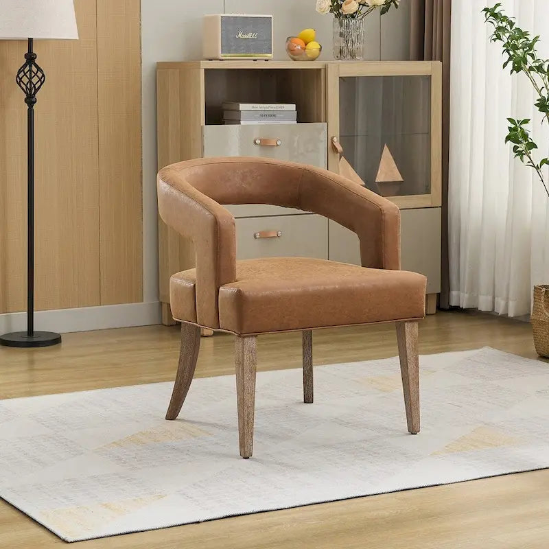 Fauteuil d’appoint rembourré, dossier ouvert et forme tonneau
