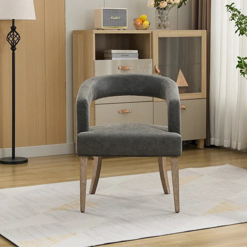 Fauteuil d’appoint rembourré, dossier ouvert et forme tonneau
