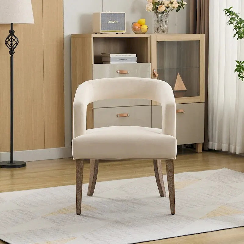 Sillón decorativo tapizado tipo barril con respaldo abierto