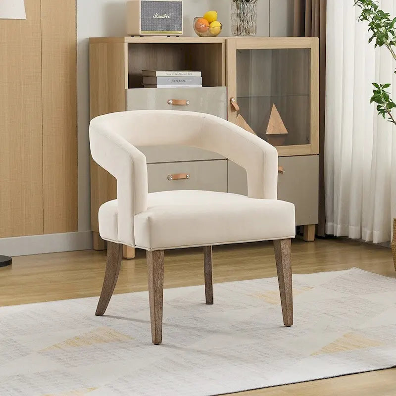 Fauteuil d’appoint rembourré, dossier ouvert et forme tonneau
