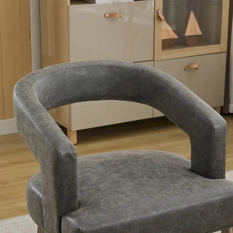 Fauteuil d’appoint rembourré, dossier ouvert et forme tonneau