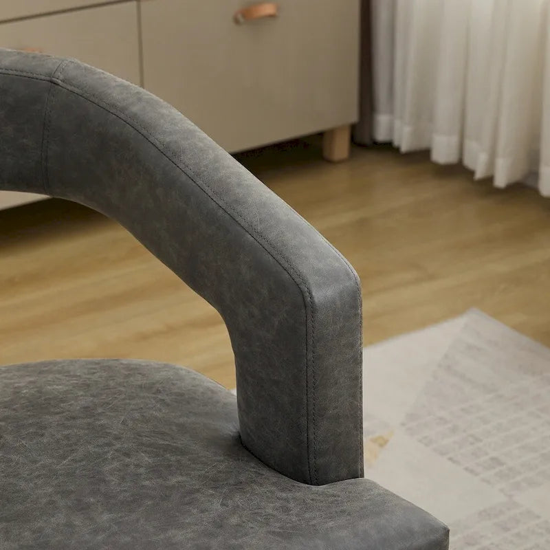 Fauteuil d’appoint rembourré, dossier ouvert et forme tonneau
