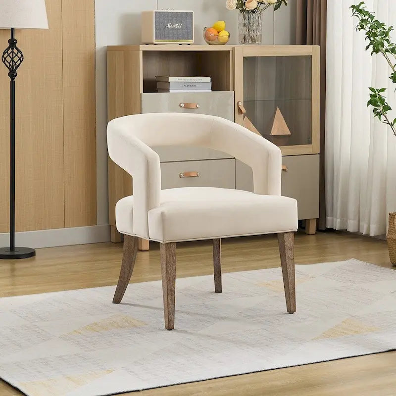 Fauteuil d’appoint rembourré, dossier ouvert et forme tonneau