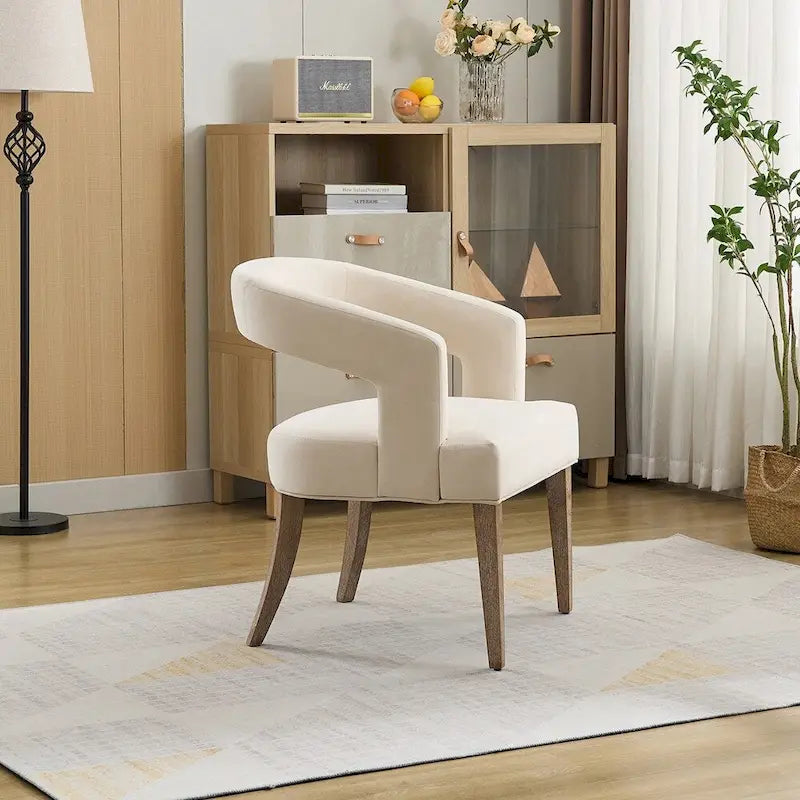 Fauteuil d’appoint rembourré, dossier ouvert et forme tonneau