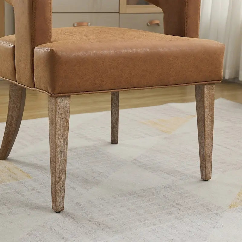 Fauteuil d’appoint rembourré, dossier ouvert et forme tonneau
