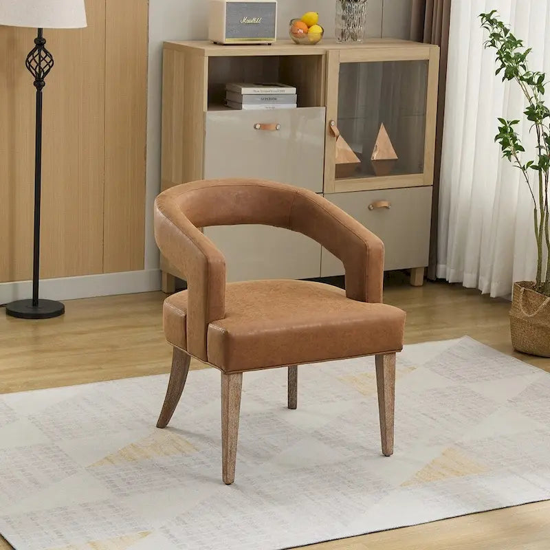 Fauteuil d’appoint rembourré, dossier ouvert et forme tonneau