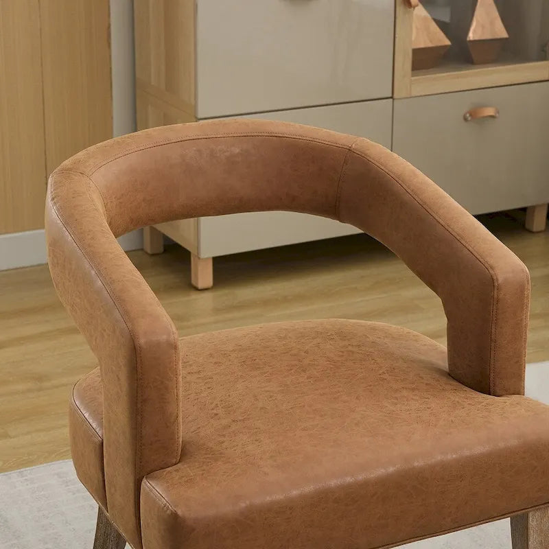 Fauteuil d’appoint rembourré, dossier ouvert et forme tonneau