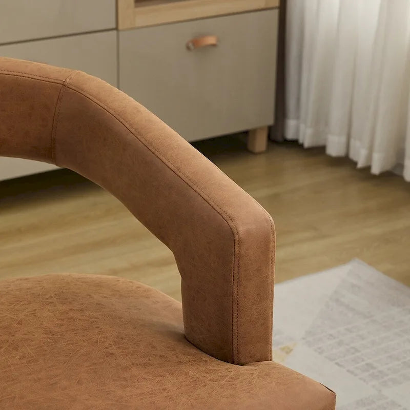 Fauteuil d’appoint rembourré, dossier ouvert et forme tonneau