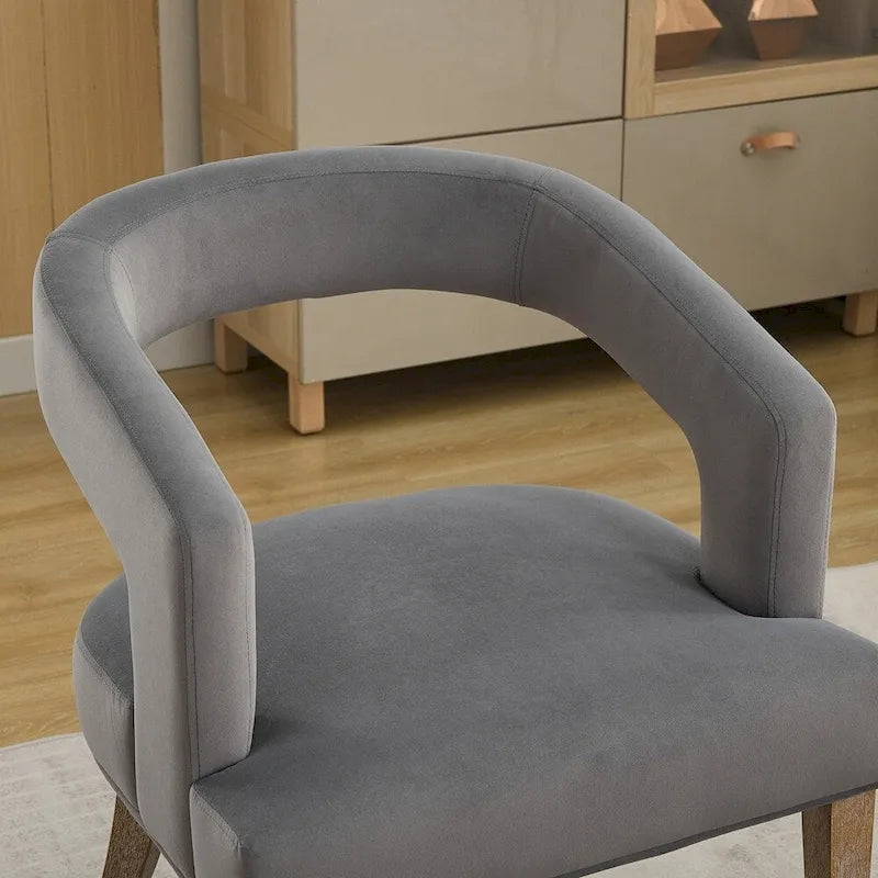Fauteuil d’appoint rembourré, dossier ouvert et forme tonneau
