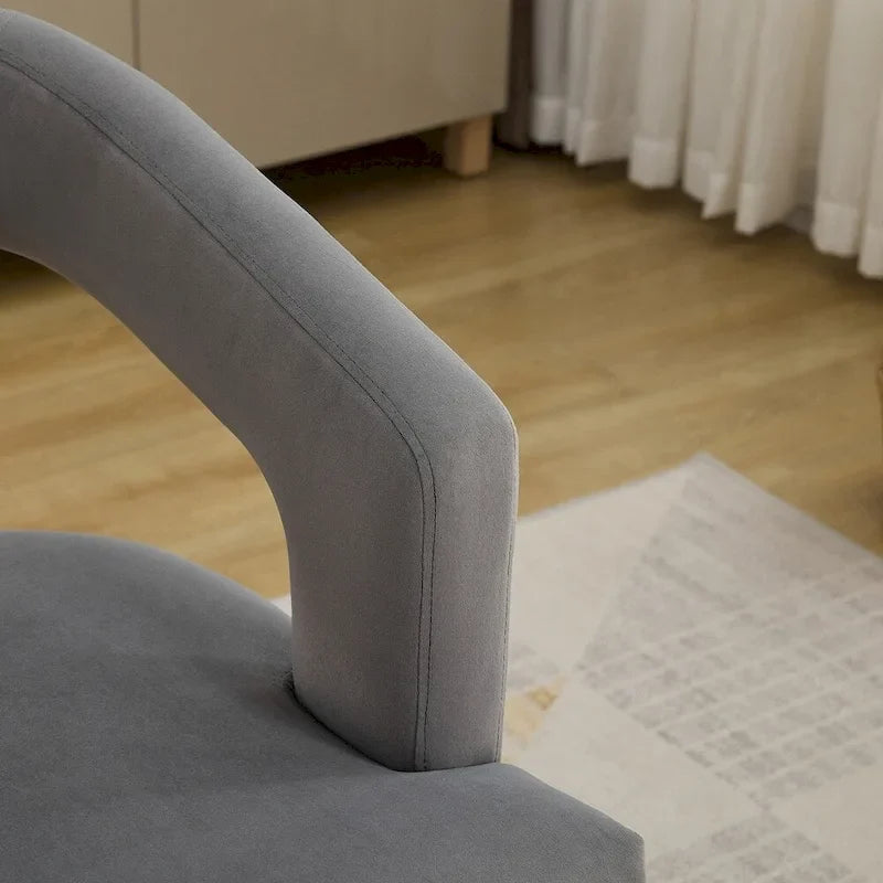 Fauteuil d’appoint rembourré, dossier ouvert et forme tonneau