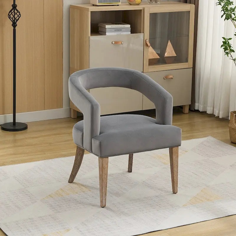Fauteuil d’appoint rembourré, dossier ouvert et forme tonneau
